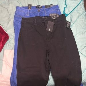 Two pairs of Fashion Nova jeans. Medium Wash. Black, both size 15.